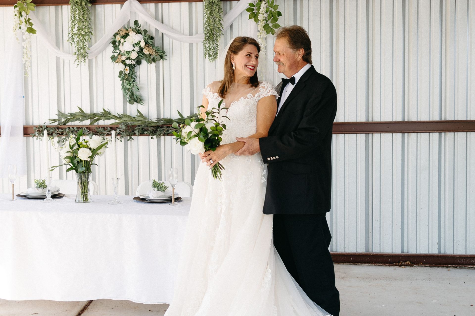 Wedding arch and guest benches placed in verdant park